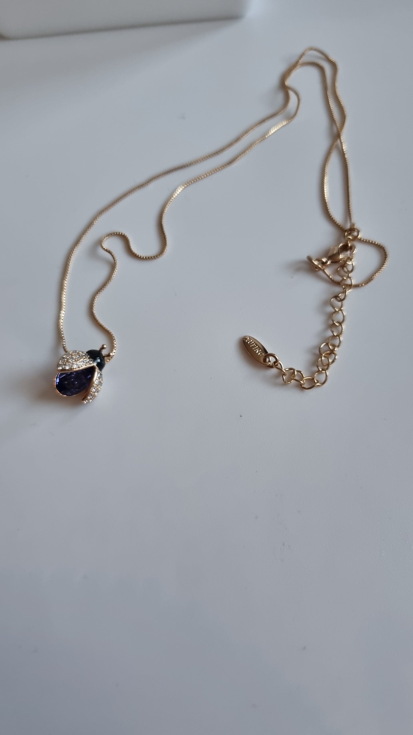 18kr.gold plated necklace with sw.crystal purple butterfly