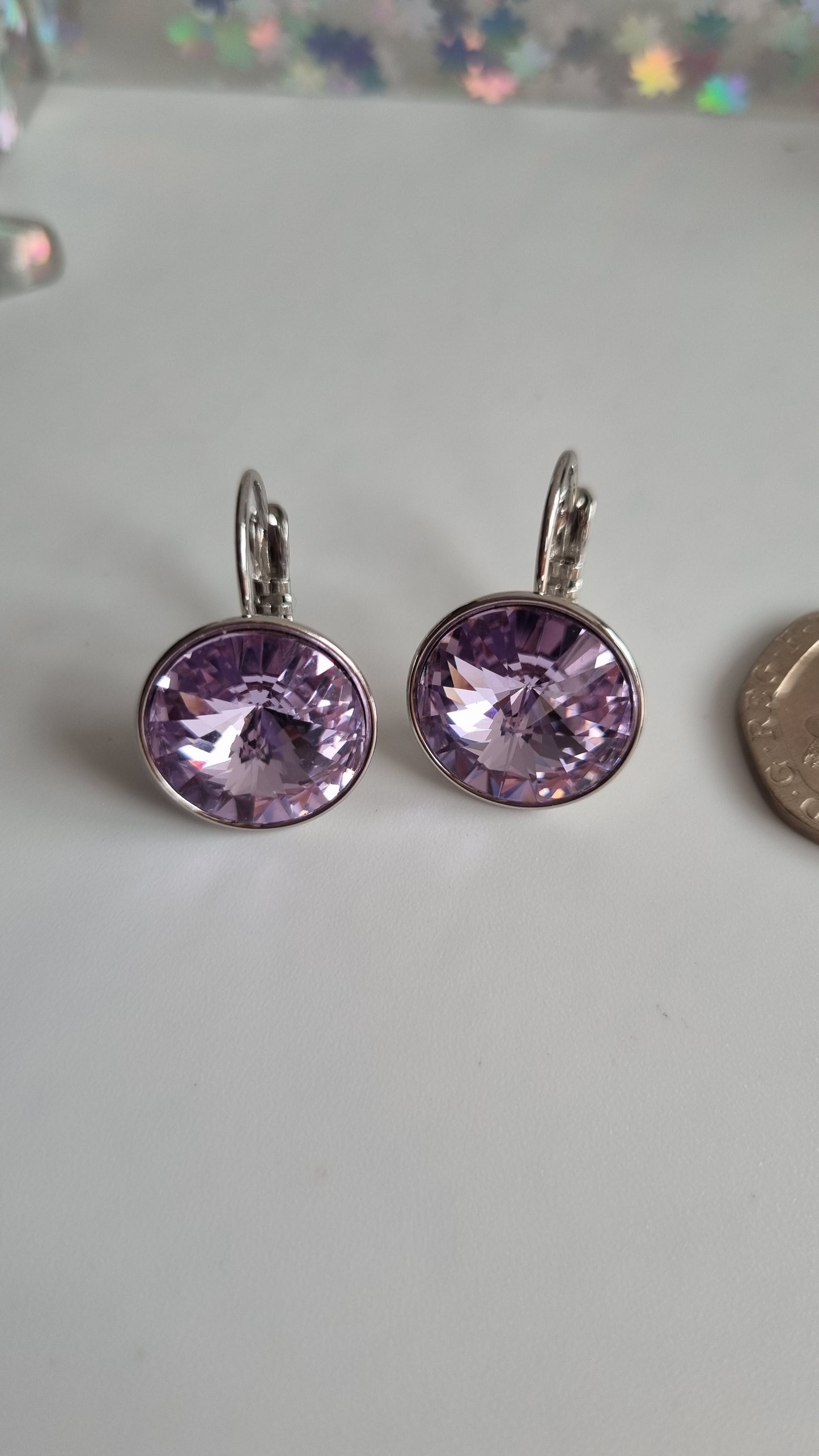 Platinum plated earrings with  violet sw.crystal waterproof hypoallergenic