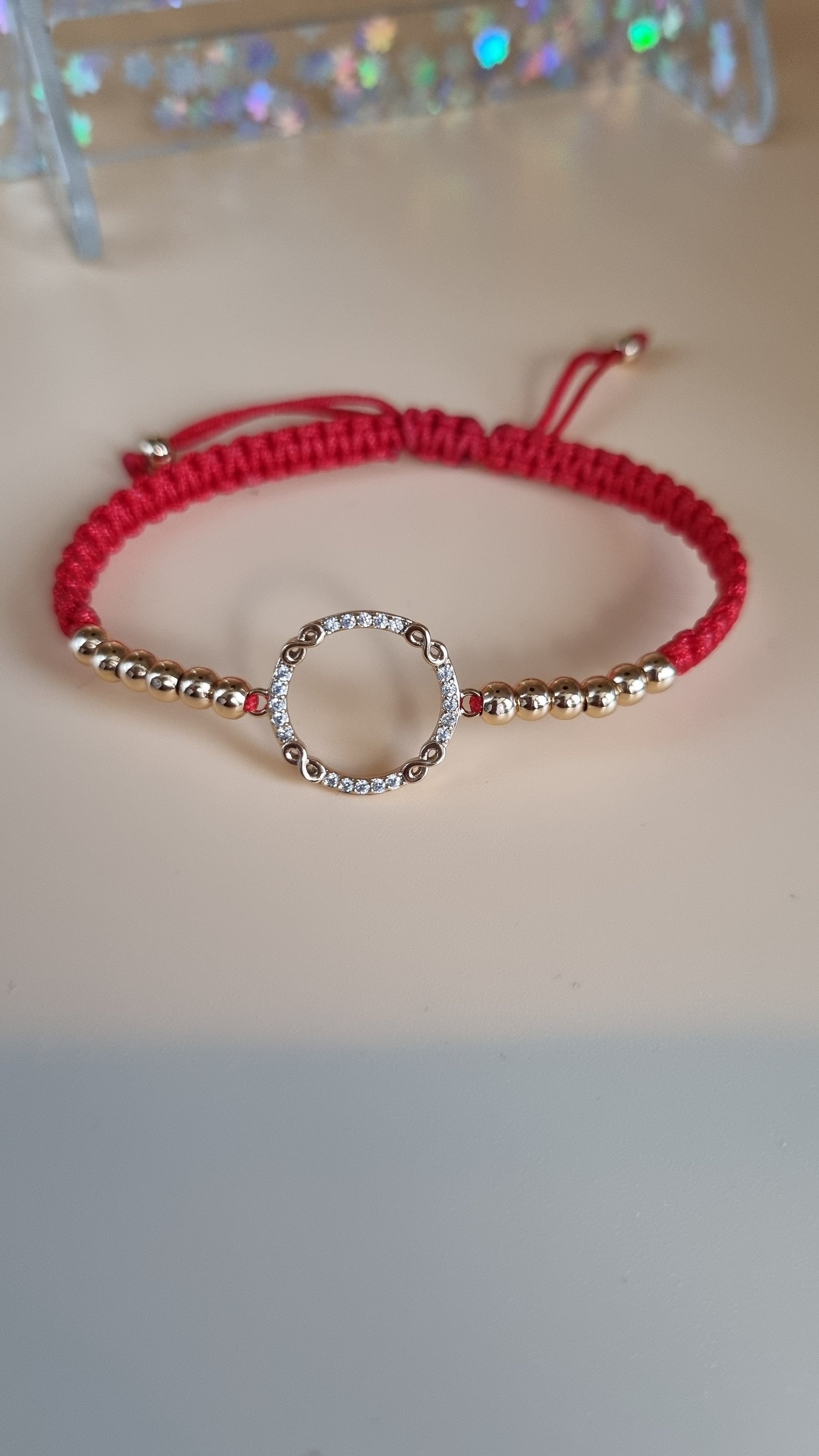 Red color bracelet with hypoallergenic waterproof beads and pendant