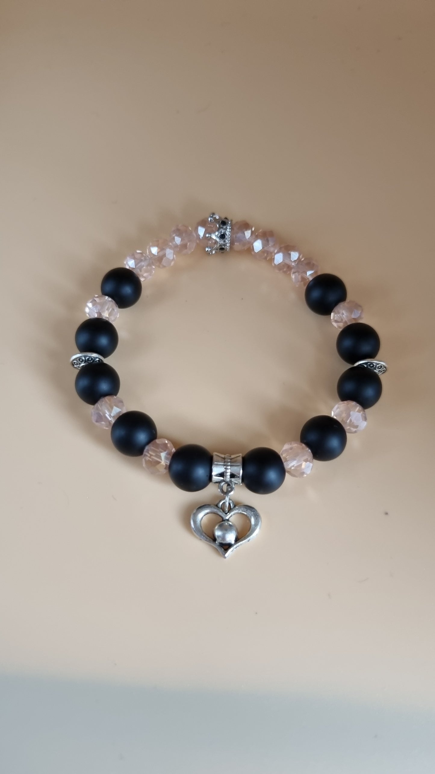 Stretchy bracelet handmade with mate onyx black and glass beads faceted pink color beads