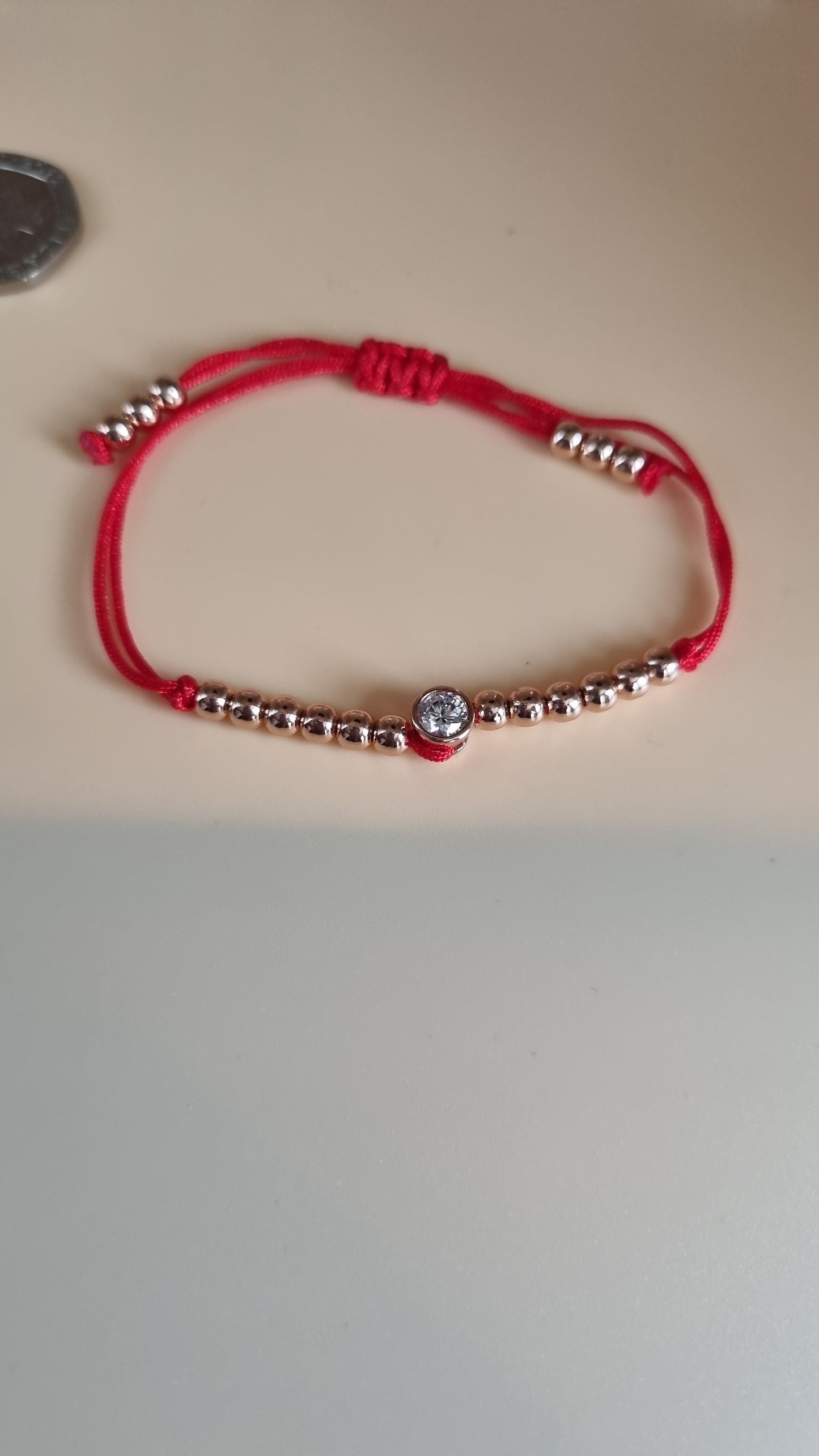 Red bracelet rose gold plated beads and zircon stones