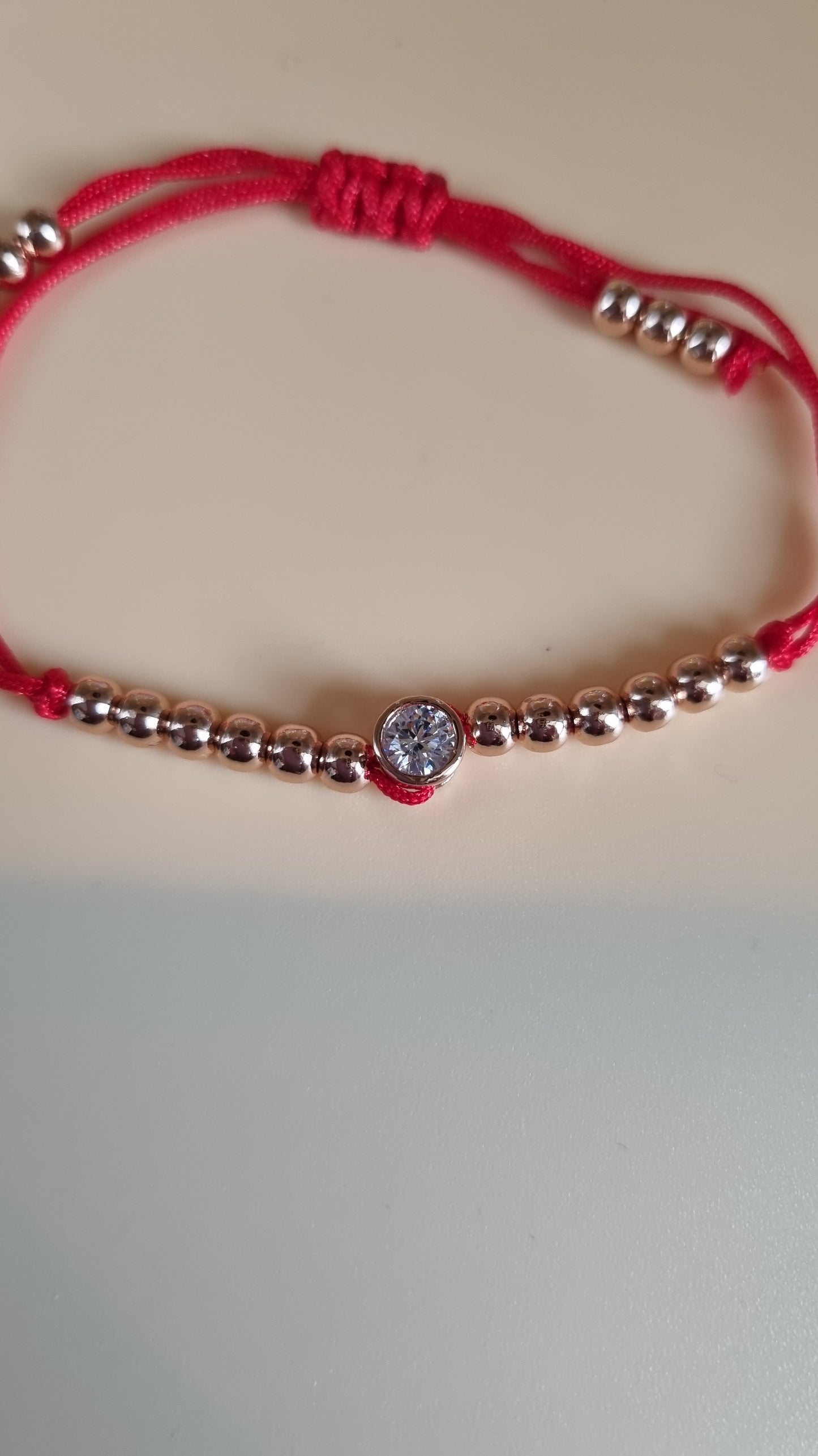 Red bracelet rose gold plated beads and zircon stones